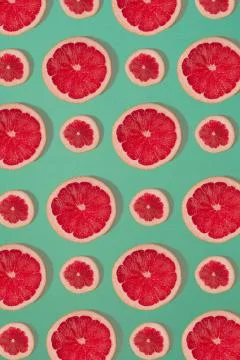 Grapefruit pattern isolated on blue background. Flat lay 写真素材