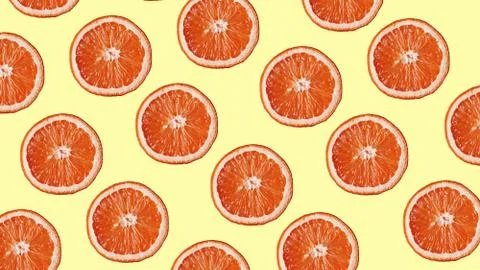 Grapefruit pattern on yellow background. Minimal flat lay concept. Stock Photos