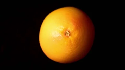 Grapefruit is roiling on black background Stock Footage 150004736