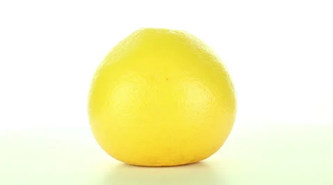 Grapefruit rotates on a black background Stock Footage 37350310