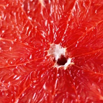 Grapefruit sliced half on grey background. Citrus fruit macro. Copy space, top Stock Photos