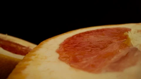 Grapefruit sliced in two On Black Background Stock Footage 131800265