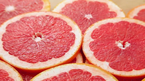 Grapefruit slices background Stock Footage 32515634