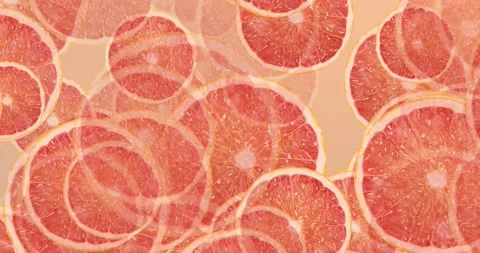 Grapefruit slices closeup top view animation loop video Stock Footage 157259945