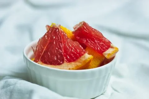 Grapefruit slices on light background Stock Photos