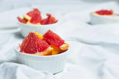 Grapefruit slices on light background Stock Photos