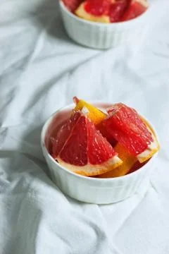 Grapefruit slices on light background Stock Photos