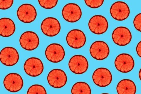 Grapefruit slices pattern Pattern made of backlit ruby grapefruit slices o... Stockfoto's
