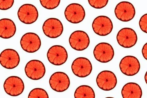 Grapefruit slices pattern Pattern made of backlit ruby grapefruit slices o... 스톡 사진