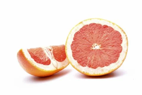 Grapefruit slices on white background Stock Photos