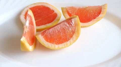 Grapefruit Slices On A White Plate Stock Footage 62741620