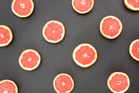 Grapefruit split in half on black background Stock Photos