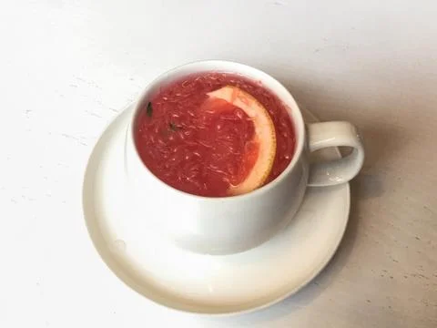 Grapefruit tea cup Stock Photos