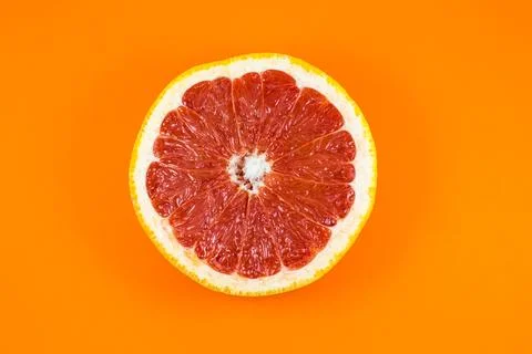 Grapefruit texture inside on the orange background. Citrus close up photo. .. Stockfoto's