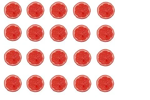 Grapefruit wheels in a row next to each other in five pieces and below each.. Stock Photos