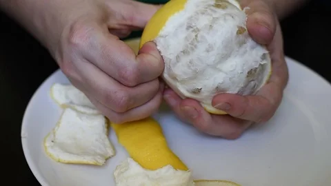 Grapefruit on a white background cleanses the skin for a meal Stock Footage 95434314