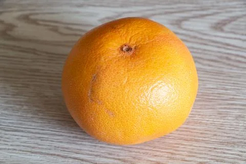 Grapefruit on wooden background Stock Photos