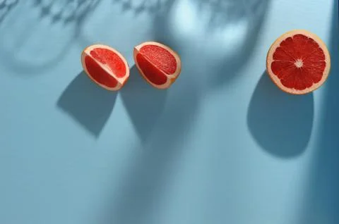 Grapefruits  on the  blue background. Stock Photos