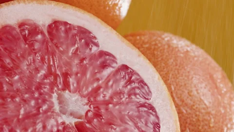 Grapefruits isolated on yellow background, pouring water on fresh and ripe Stock-Footage 170725879