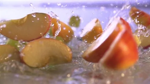 Grapes and Apple  falling in water Stock Footage 76437189