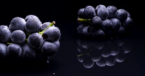Grapes on black reflective background 4K dolly video Video stock 198790622