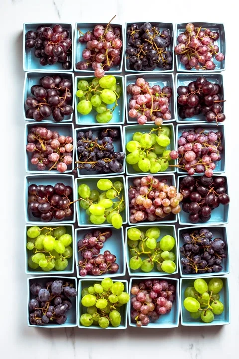 Grapes in blue boxes endless loop stop motion. Stock Footage 159886337