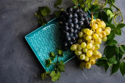 Grapes on the ceramic plate Stock Photos