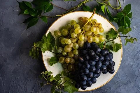 Grapes on the ceramic plate Stock Photos