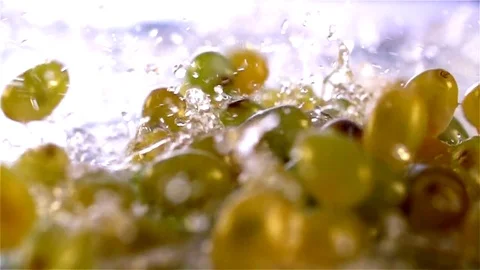 Grapes  falling in water Stock Footage 77076516