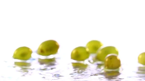 Grapes  falling in water Stock Footage 77076544