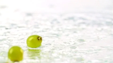 Grapes  falling in water Stock Footage 77076549