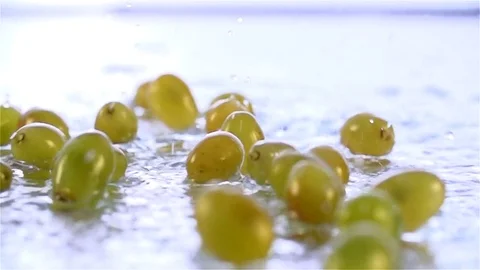 Grapes  falling in water Stock Footage 77076579