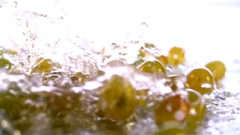Grapes  falling in water Stock Footage 77076583