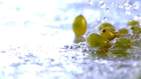 Grapes  falling in water Stock Footage 77076625