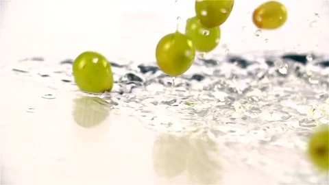 Grapes  falling in water Stock Footage 77076684