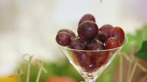 Grapes in a glass on table 스톡 동영상 69172873