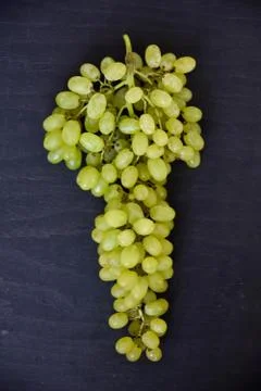 Grapes on a gray background. Stock Photos