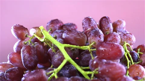 Grapes isolated rotating on pink background Stock Footage 62414068