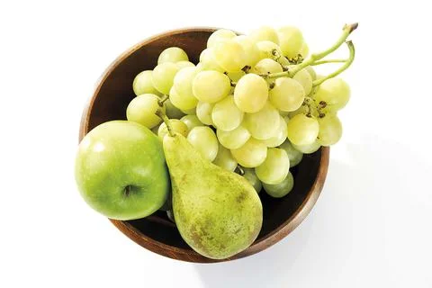 Grapes, pear and apple in wooden bowl, elevated view Stock Photos