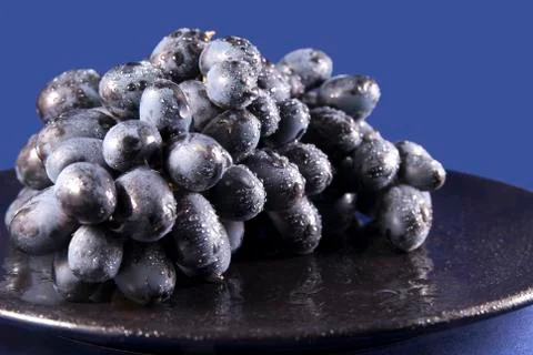 Grapes on the plate Stock Photos