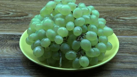 Grapes put on a plate Stock Footage 79723701