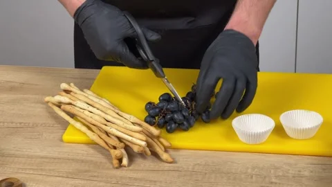 Grapes Snipping on Board with Snacks Stock Footage 256972782