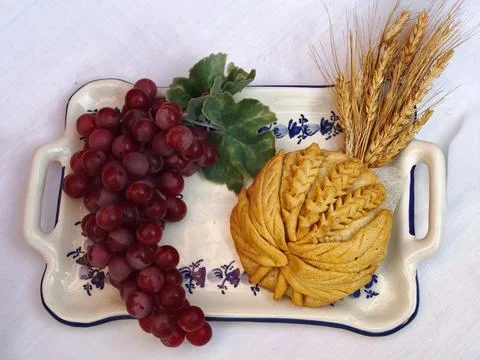 Grapes, wheat, and bread representing holy communion Stock Photos