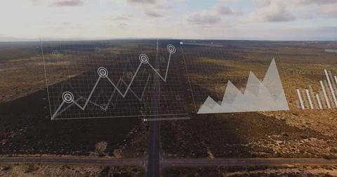 Graph and bar chart image over aerial view of road through desert landscape 스톡 사진