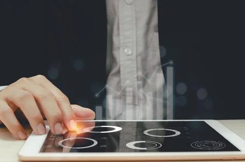 Graph business documents in a tablet Stock Photos