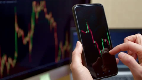 Graph of crypto currency or shares on the financial stock exchange. Phone screen Stock Footage 248827043