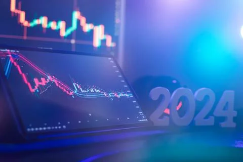 Graph hologram on table with computer background. Concept of financial market Stock Photos