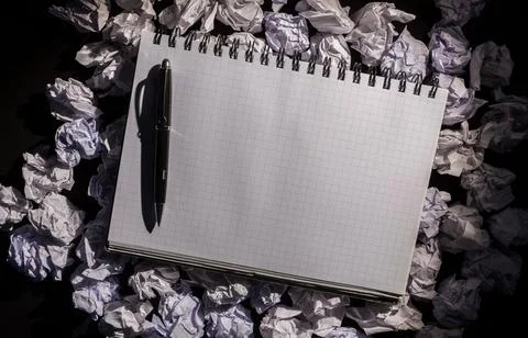 Graph paper notebook with pen Stock Photos