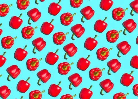 Graphic Background Pattern Of Red Peppers Against Blue Background Stock Photos
