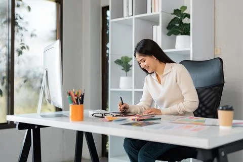 Graphic design process with a smiling professional in a creative workspace Stock Photos